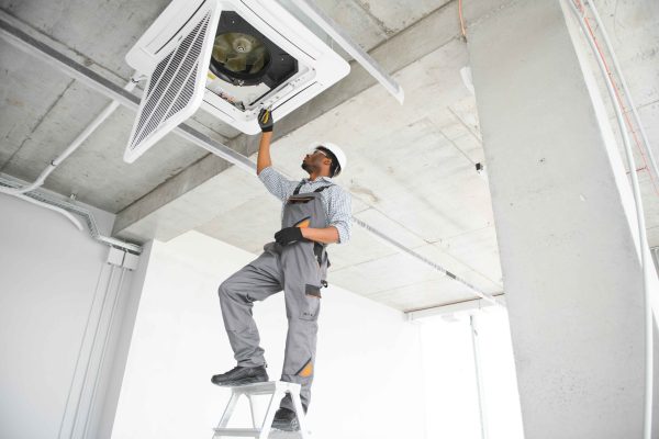 ac-electrician-technician-repairing-air-conditione-2024-06-11-20-52-27-utc_11zon